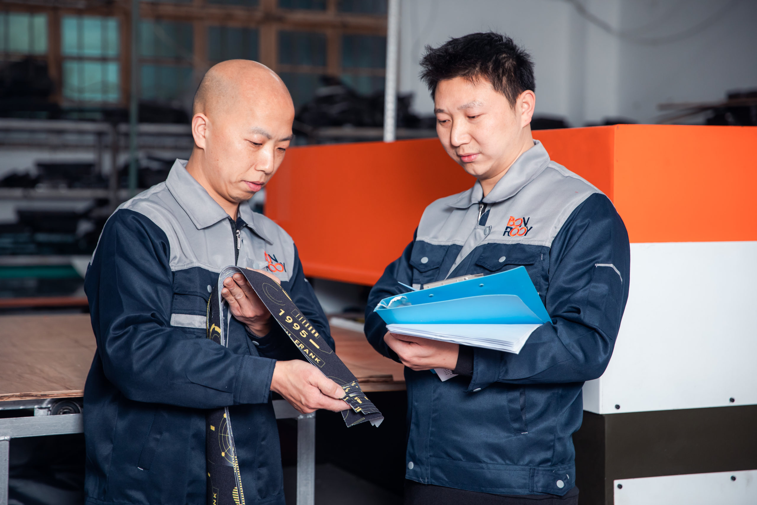 Two staff members working on new fabrics.