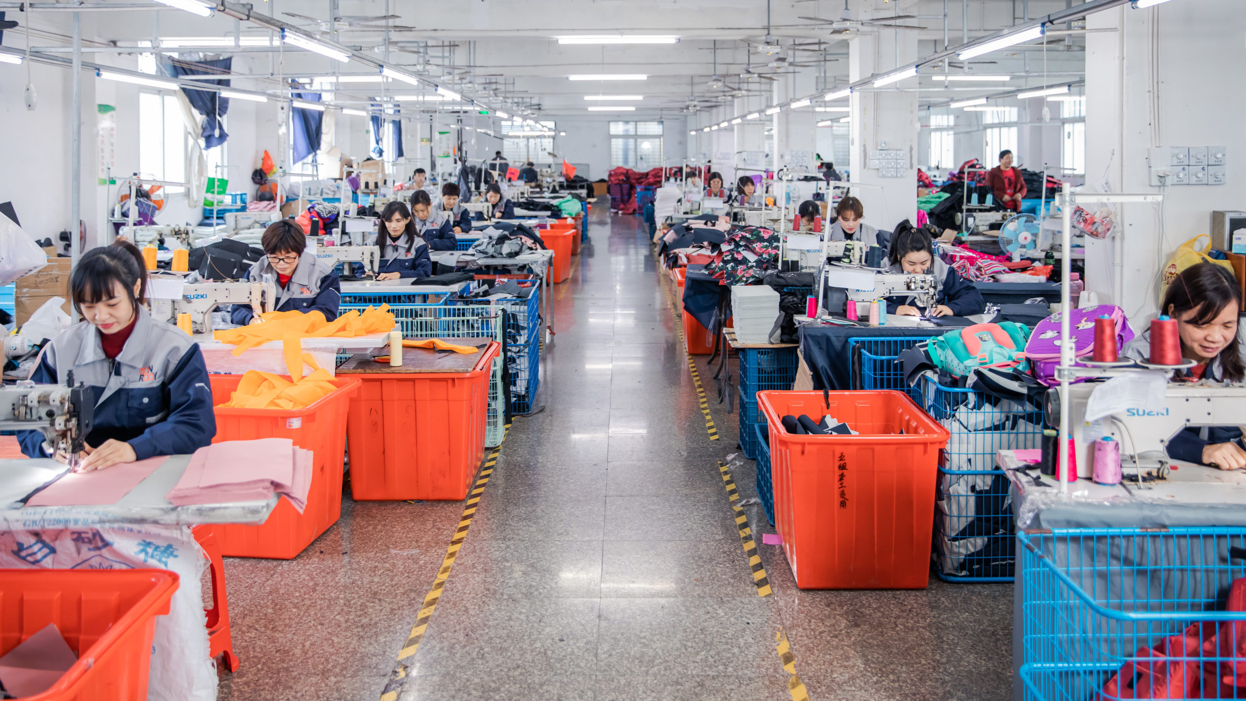 Inside the workshop, workers meticulously sew products.