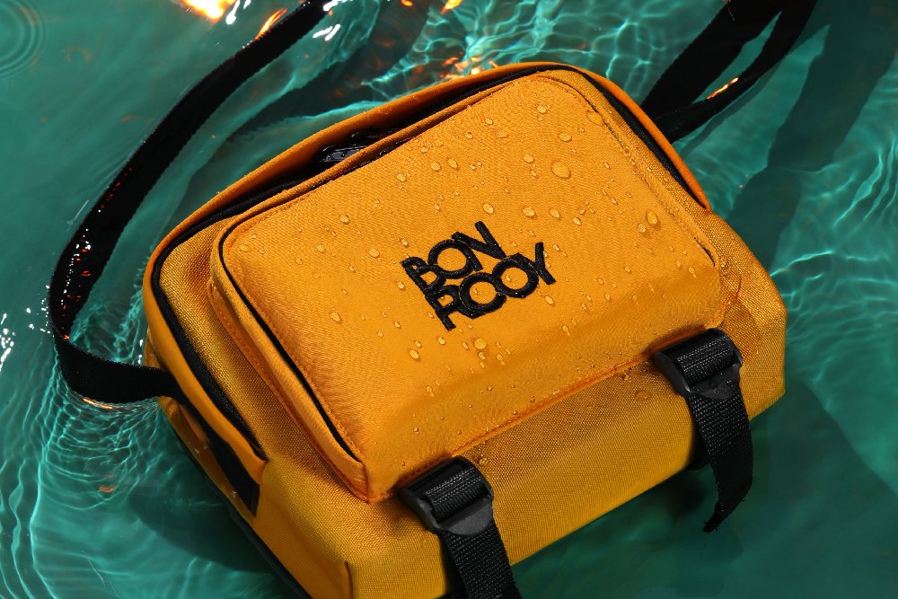 A yellow bag with Bonrooy's logo printed on it.